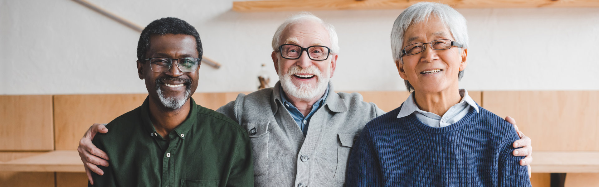 Three person smiling